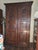Beautiful circa 1800 heavily carved French Armoire with modified interior file drawers and fully lined vintage Fortuny...
