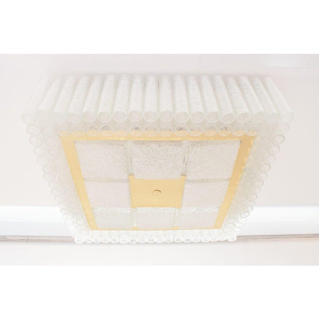 - Large ceiling lamp from Doria Leuchten - Total of 132 glass tubes and 8 square glass pieces - Requires 16 E27 bulbs This...