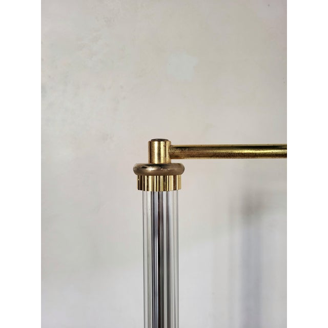 Vintage floor lamp with a new linen-effect shade. The lamp is hinged to adjust the shade. Brass details and an altuglas...