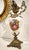 Spectacular bronze and porcelain vase from the 1950s, originating from France. Rising from a bronze base carved with...
