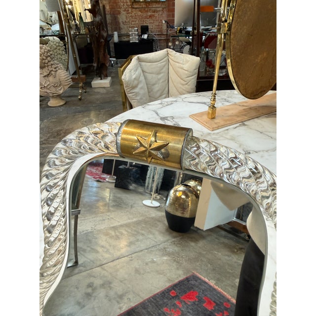 Elegant vintage tabletop vanity mirror featuring a sculptural twisted clear art glass frame in the Murano style with...