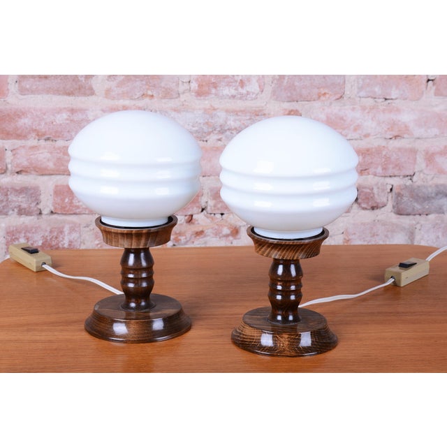 This pair of elegant table lamps originates from 1930s Czechoslovakia and represents a refined example of Art Deco era...