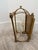 French provincial style sconce in gilded distressed brass.