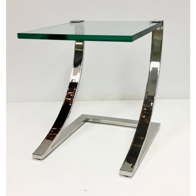 Stylish contemporary polished nickel and glass side table, thick glass top, showroom floor sample