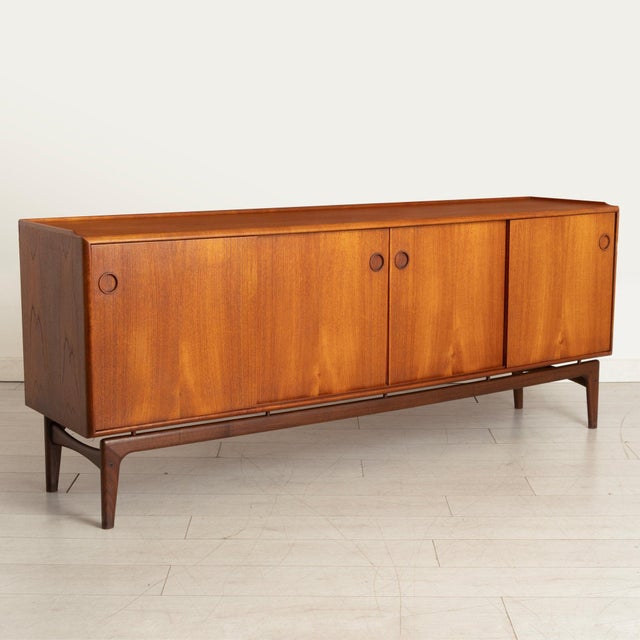 Danish Mid Century teak sideboard by Arne Hovmand Olsen for Mogens Kold, circa 1960s. Fully restored condition, signs of...