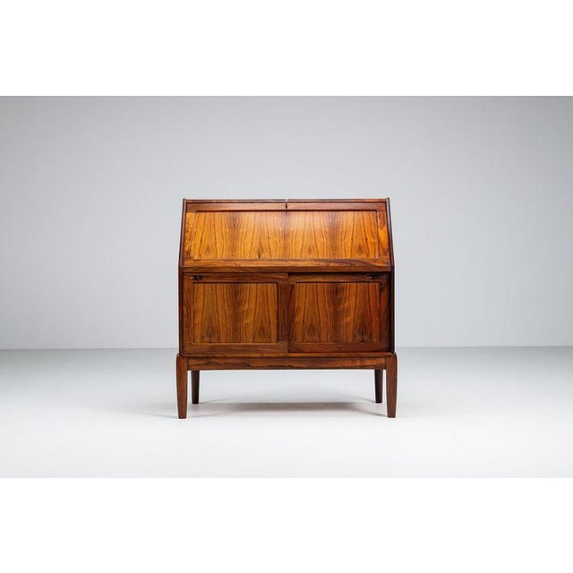This elegant secretary cabinet was designed by H.W. Klein and produced by Bramin, Denmark, circa 1960. A refined example...