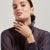 The Annette Ring showcases a classic design, with a trio of emerald-cut multi-colored stones meticulously set to create a...