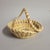 An elegant Gullah sweetgrass basket from Charleston, South Carolina, measuring 6.5" in diameter and 5" high including the...