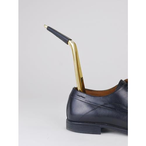 A sleek, elegant Mid-Century Modern brass shoehorn with black leather detail, model no. 4225, designed and handcrafted by...