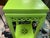 20th century chinoiserie tall side table. Painted in a bright green over original finish. Pretty carved details along...