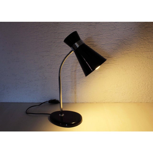 Diabolo desk lamp black and chrome 1970/80 Here is an original model of diabolo lamp in black lacquered metal. Published...
