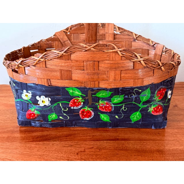 Beautiful antique hand-painted gathering basket with a strawberry plant, blossoms, and fruits on a black background. Made...
