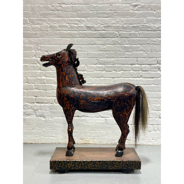 Highly expressive antique European folk horse, hand carved from solid wood and retaining its original painted surface,...