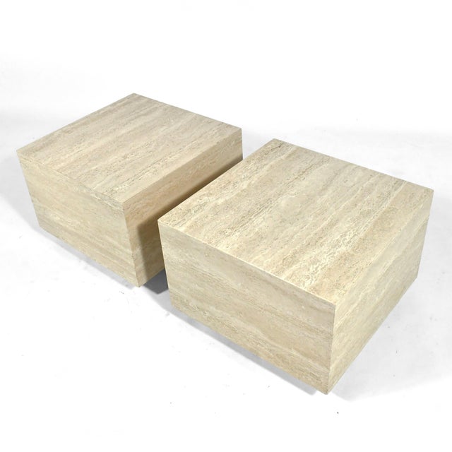 This pair of substantial side tables executed in rich travertine have a wonderful scale and an understated quality with...