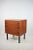 A stylish chest of drawers from the 1970s with a distinctive, modernist design. The piece is upholstered in a warm natural...
