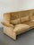 The three-seat companion to Magistretti's adjustable wingback design, built on the same idea: side headrests that move to...