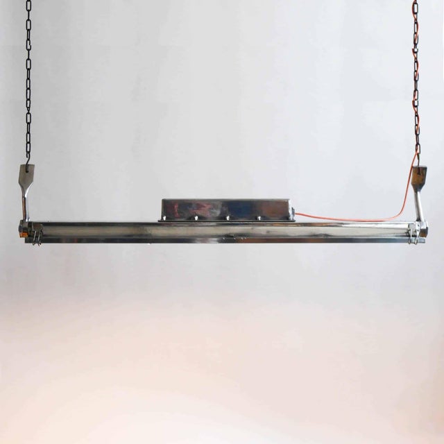 Vintage american industrial pendant light, made of cast aluminum and glass. This lamp has been fully restored (stripped...