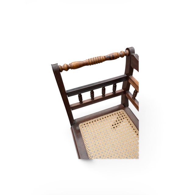 A wonderfully distinctive antique telephone conversation table, also known as a gossip bench or telephone chair, featuring...