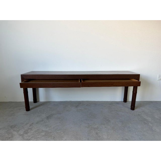 Elegant 1980s Century Furniture console or sofa table featuring a rich warm walnut-toned finish with stylish faux bamboo...