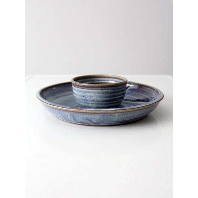 This vintage Steve Coburn studio pottery platter is the perfect serving piece. The round tray features a center bowl, and...