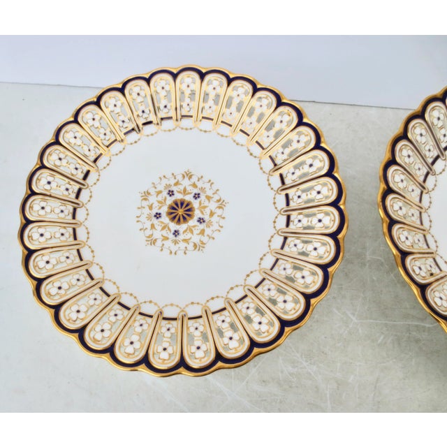 Mintons porcelain reticulated cabinet plates. A matching pair mid-19th century for Green and Nephew Store. Hallmarked to...