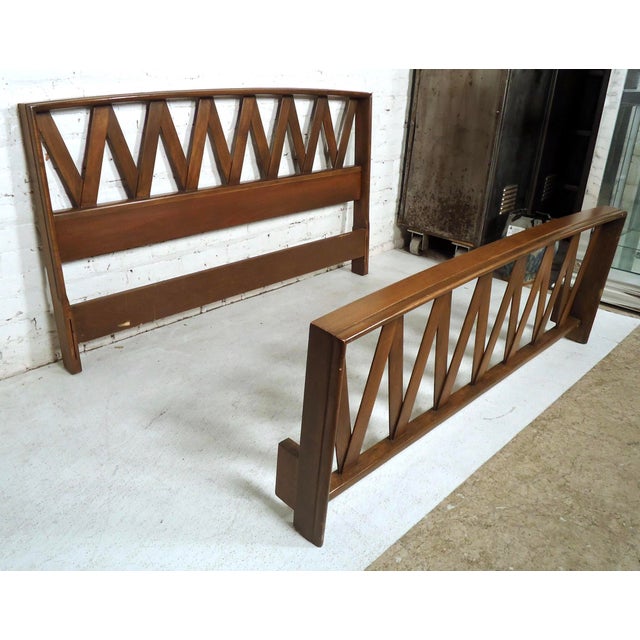 Gorgeous vintage modern bed frame by Paul Frankl features a dark finish, crisscross designed headboard and foot board. No...