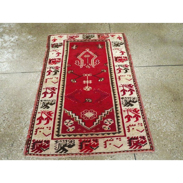 A vintage Turkish Oushak throw rug handmade during the Mid-20th century. Measures: 2' 8" x 3' 11"