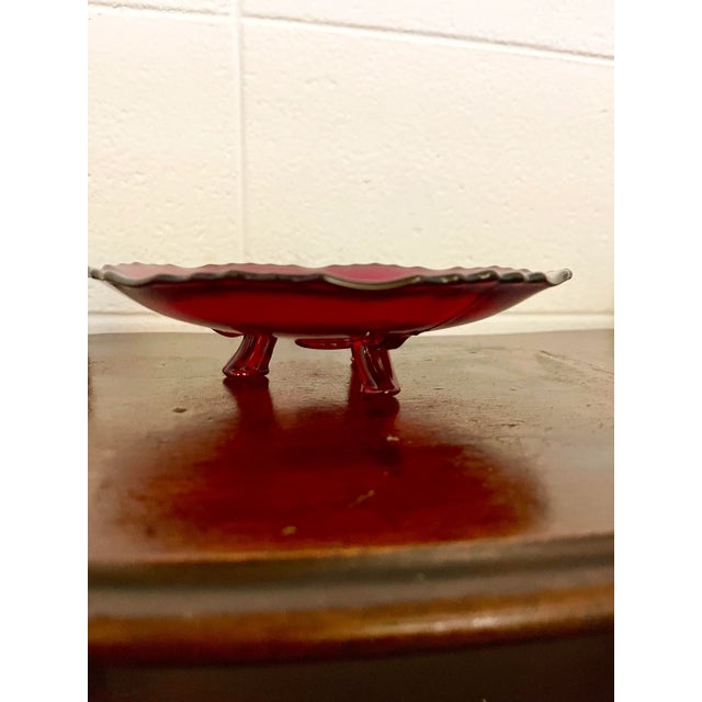 Small footed dish in red glass. Perfect for holiday candies or nuts! Excellent vintage condition with no chips, cracks, or...
