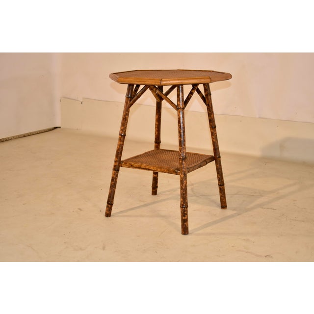 19th century tortoise bamboo side table from France with an octagonal shaped top. This table is darling! The top has...