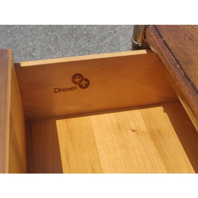 This vintage Drexel Accolade campaign dresser seamlessly blends mid-century modern sophistication with rugged, functional...