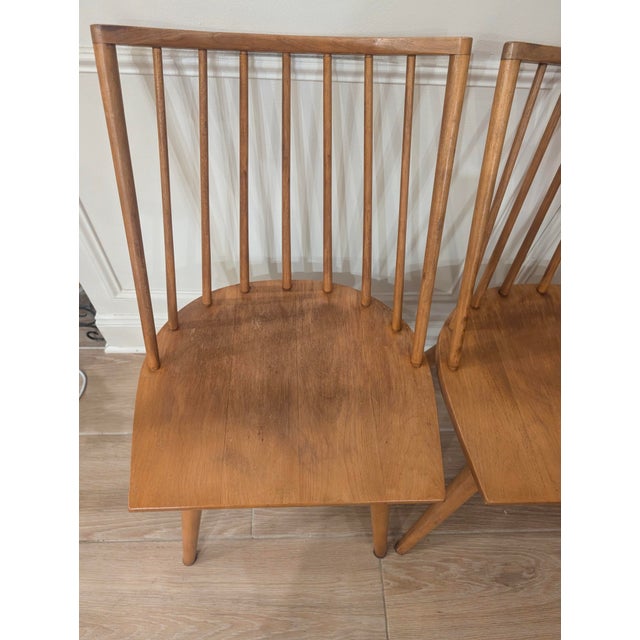 Set of four Model 7408 spindle back dining chairs designed by Leslie Diamond for Conant Ball’s iconic Modernmates line,...