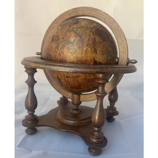 Vintage 1960's Italian Latin Explorer Old World Globe with Astrology Base - Made in Italy. This vintage wooden tabletop...