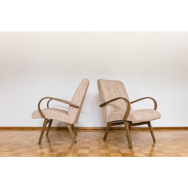 Pair of armchairs type 53, designed by J. Šmidek for TON, Czechoslovakia, 1960's The distinguishing element of this model...