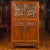 An antique Chinese Ming dynasty style cabinet from the 19th century, with two pairs of double doors, two drawers, carved...