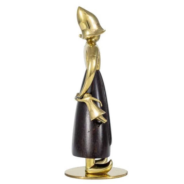 Dutch girl with a doll, model no. 4234c, franz hagenauer, werkstatte hagenauer vienna, ca. 1936, brass and carved wood,...