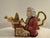 An eye-catching vintage ceramic figural teapot featuring the legendary composer Johann Sebastian Bach seated at an ornate...