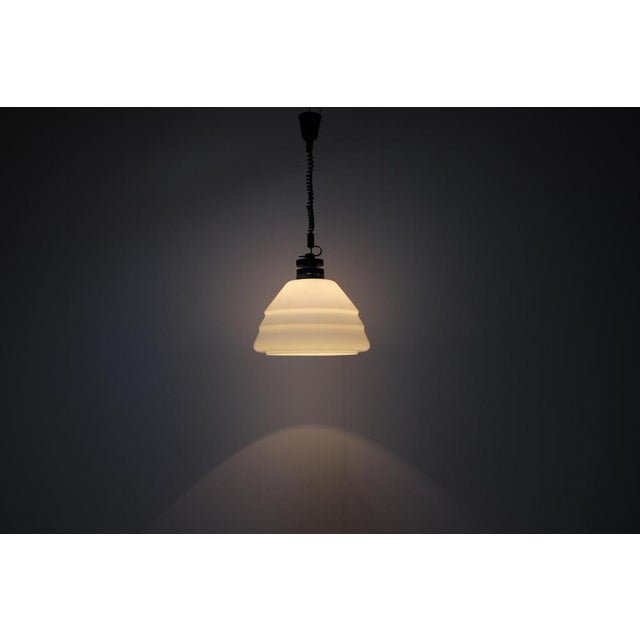 Extendable (extends up to 154cm) vintage chandelier, made in former Czechoslovakia, in the 1970's. Made of chrome, metal...