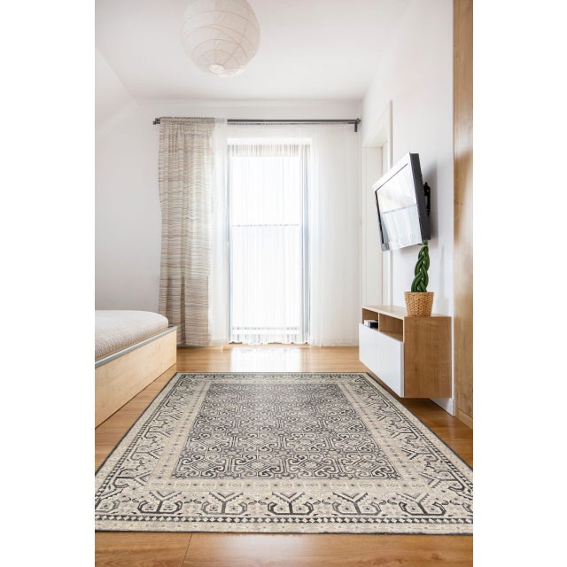 Rhea Elena Purple Hand Knotted Wool Rug, Country of Origin: India. This exquisite piece is a testament to the enduring...