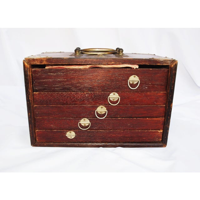 An antique Mah Jong set dated 1923 in original wooden box. Complete set with tiles, four dice, numerous sticks and...