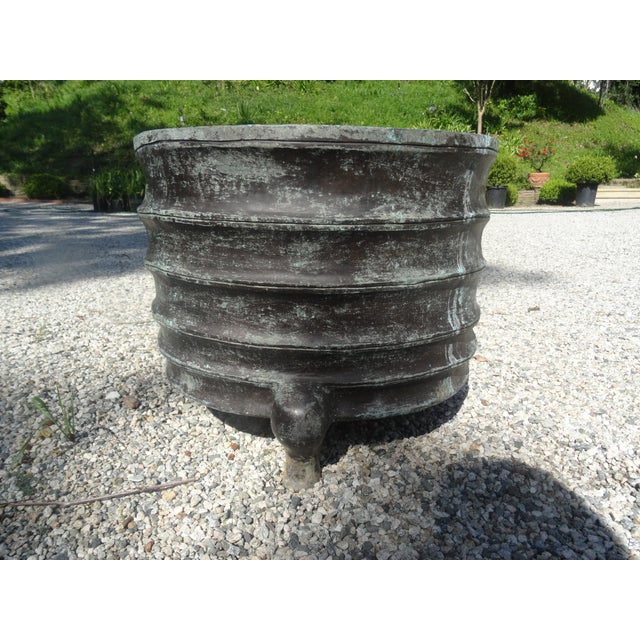 A fine quality Chinese bronze Jardiniere or planter with 3 feet. from the mid 20th century not drilled good for interior...
