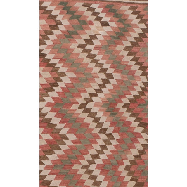 Turkish flat-weave Kilims are known for their unique charm and intricate hand-woven details. The muted palette of ivory,...