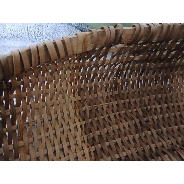 Antique hand-woven wood splint "buttocks" or "melon" basket, early 20th century. Carved, bentwood handle and woven splint...