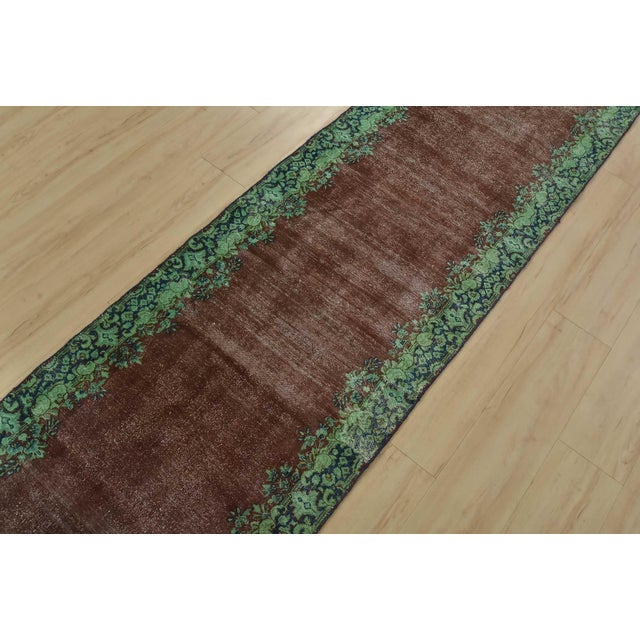 An authentic vintage traditional overdyed Tabriz runner hand-knotted with fine wool and natural dyes. This oriental rug...