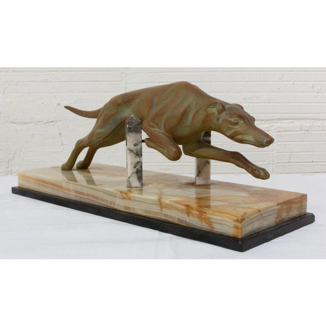 French Art Deco greyhound marble and patinated spelter circa 1930. Good condition. Dimension: P12/ L 35/ H 13. Good...