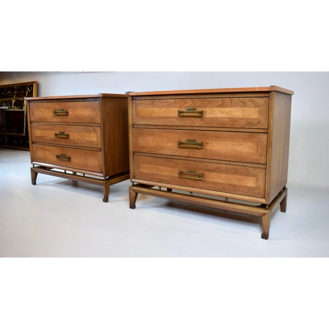 A pair of high-quality Mid 20th century Modern commode chests by White Furniture of Mebane, expertly crafted of walnut...