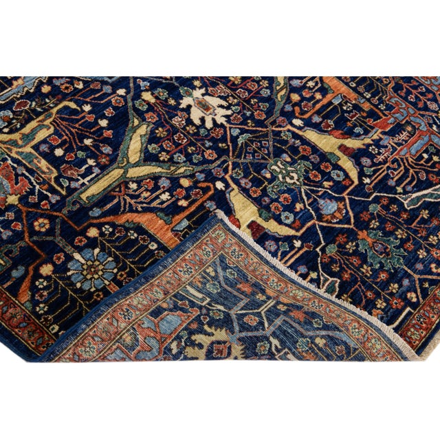 Beautiful modern Bidjar Style hand-knotted wool rug with a dark blue field. This piece has multicolor accents that feature...