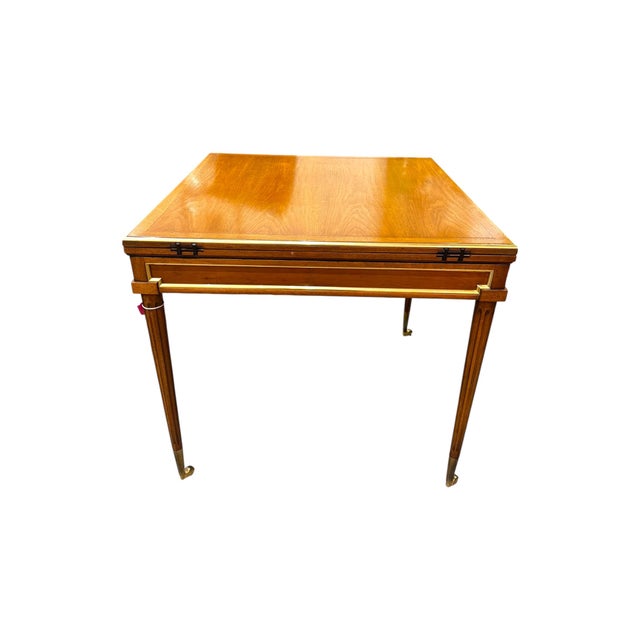 A beautifully crafted vintage game table that seamlessly blends elegance with function. Featuring a warm wood finish,...