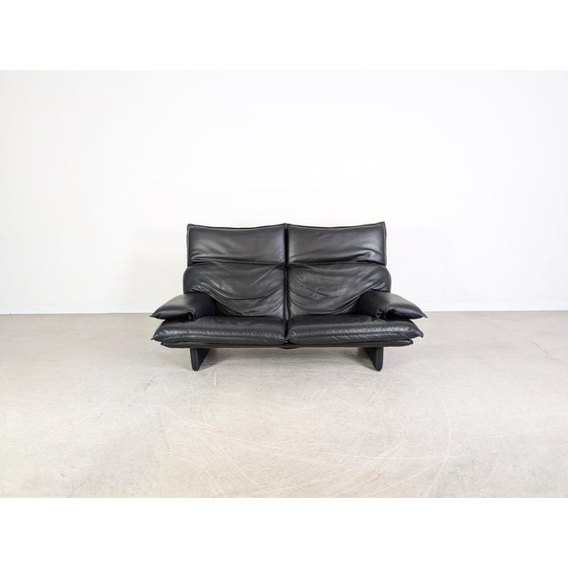 Beautiful vintage Italian sofa from the 1980s for sale. This three-seater features adjustable headrests and is...