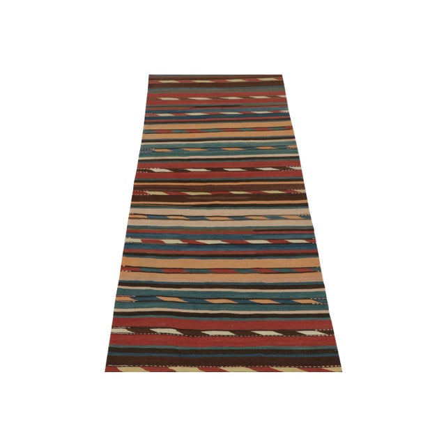 This vintage 4x10 Persian kilim is a unique tribal rug for its period and provenance. Handwoven in wool, it’s believed to...