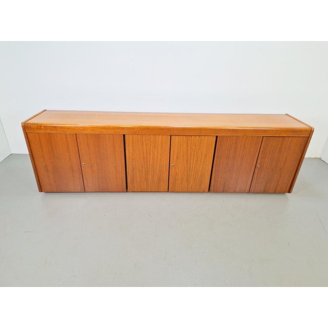 Vintage teak Danish sideboard 237 cm ’60 The vintage teak Danish sideboard consists of three storage compartments with six...